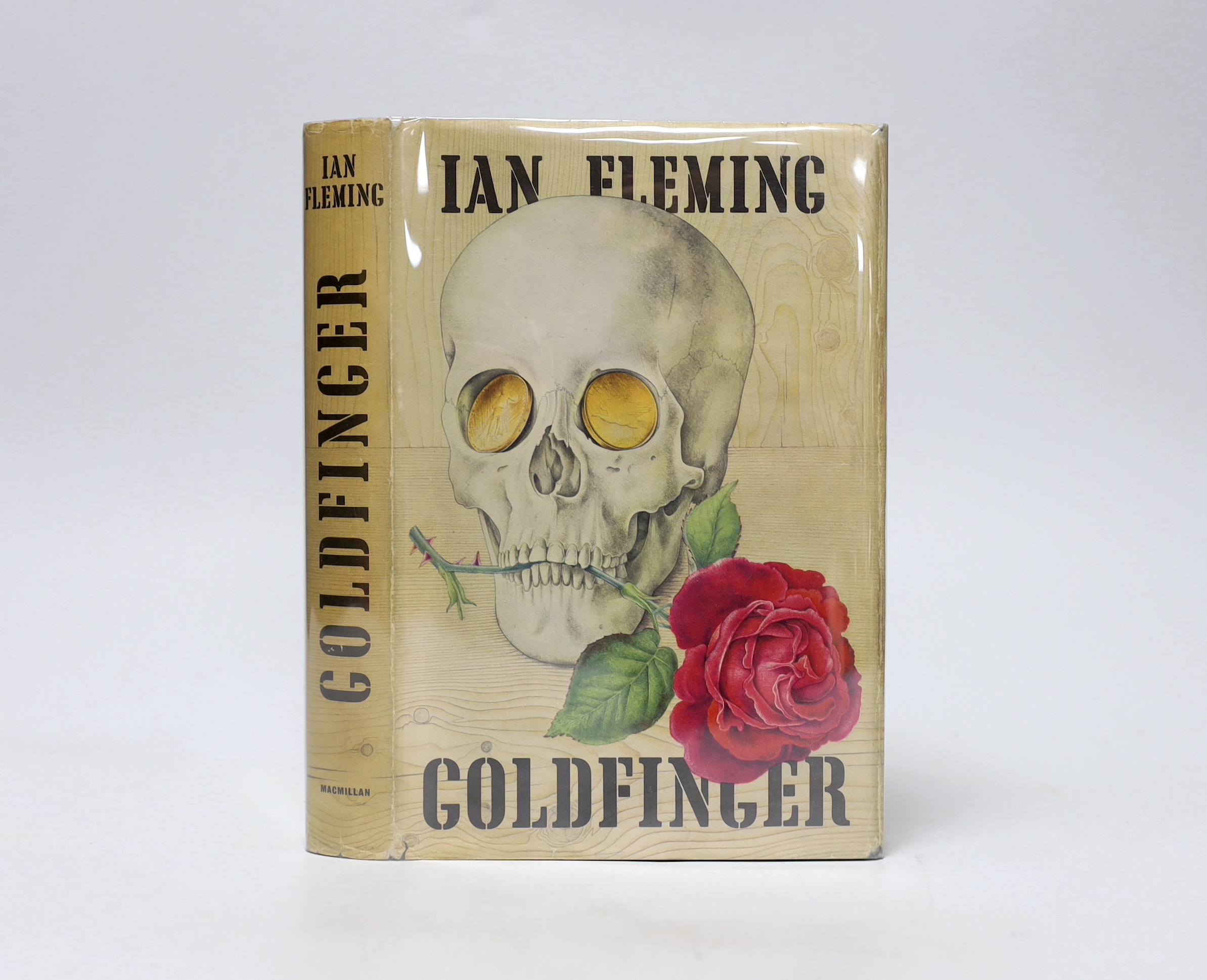 Fleming , Ian - Goldfinger, 1st US edition, 1st issue, 8vo, cloth-effect paper over boards, with ‘’skull’’ design to upper, in original pictorial price clipped d/j, designed by Richard Chopping, The Macmillan Company, Ne
